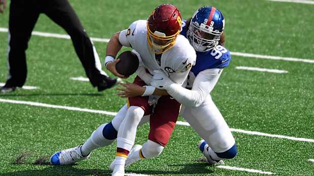 Kyle Allen Tackled © Danielle Parhizkaran  2020 Oct 18